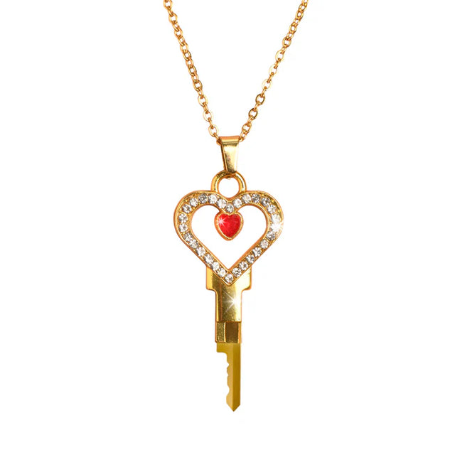 Gold key-shaped pendant with a heart design and red stone Chastity Key Necklace