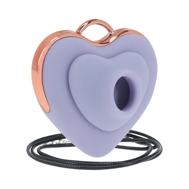 Heart-shaped lavender vibrator with rose gold accents and a black cord on a white background