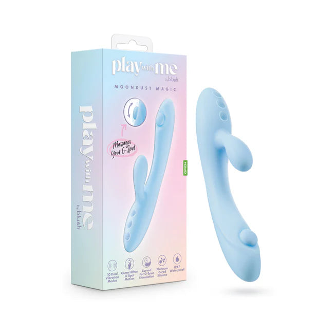 A blue dual-stimulation vibrator with a smooth, curved design and a smaller extension for clitoral stimulation. The product is shown alongside its packaging, which is light blue with playful graphics and product information.