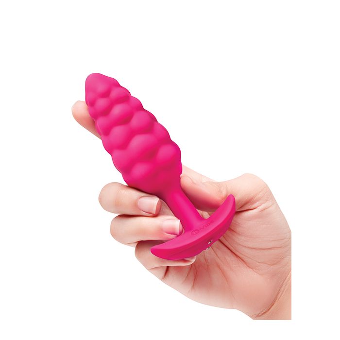 pink silicone t base vibrating butt plug with bump texture from b-vibe