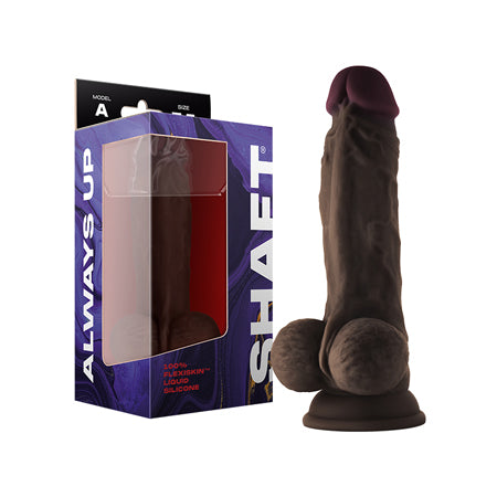 A realistic-looking dildo with balls, in a flesh-like color, shown next to its packaging which reads ' Shaft Model A '.