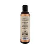 an 8.5 ounce bottom of sliquid cedar mint massage oil for couples