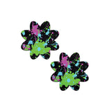 Two flower-shaped nipple covers with neon color paint splatter design.