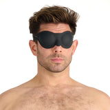 a man wearing the prowler red black silicone blindfold