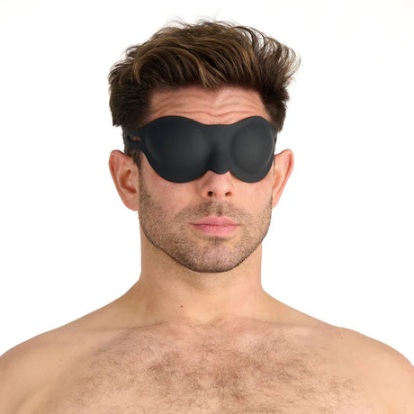 a man wearing the prowler red black silicone blindfold