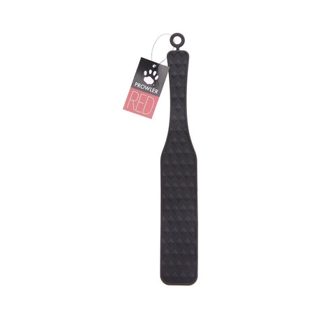 black silicone paddle for impact play with studded pattern.