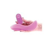 the rocker grind pad being held in hand with it's remote control