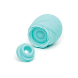 Turquoise clitoral rose toy stimulator that glows in the dark and its attachment