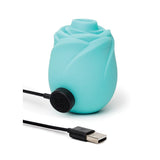 Turquoise clitoral rose toy stimulator that glows in the dark