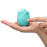 Turquoise clitoral rose toy stimulator that glows in the dark