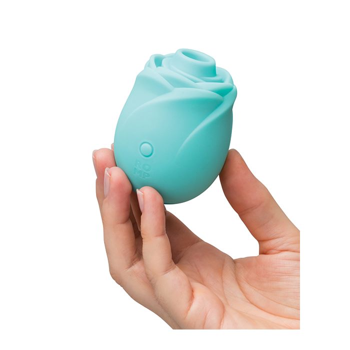 Turquoise clitoral rose toy stimulator that glows in the dark